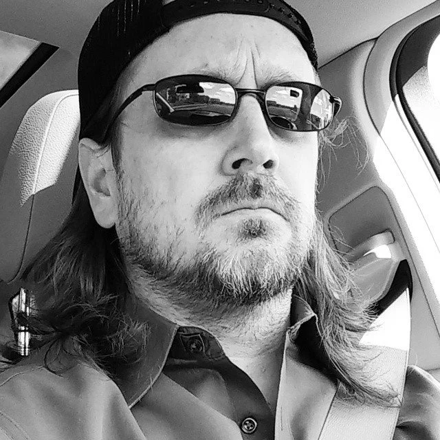 Patrick D. Stuart with hair and beard